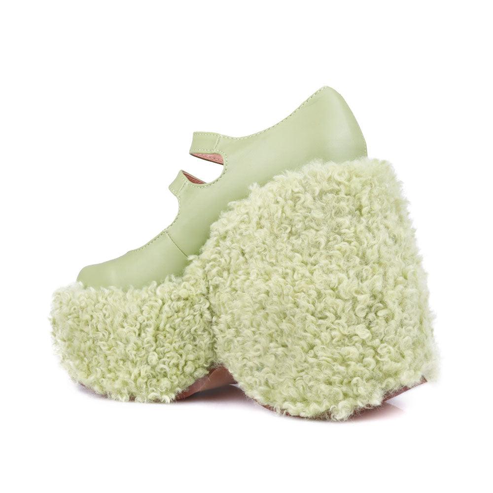 Women's shaggy wedge heel in green-posterior view