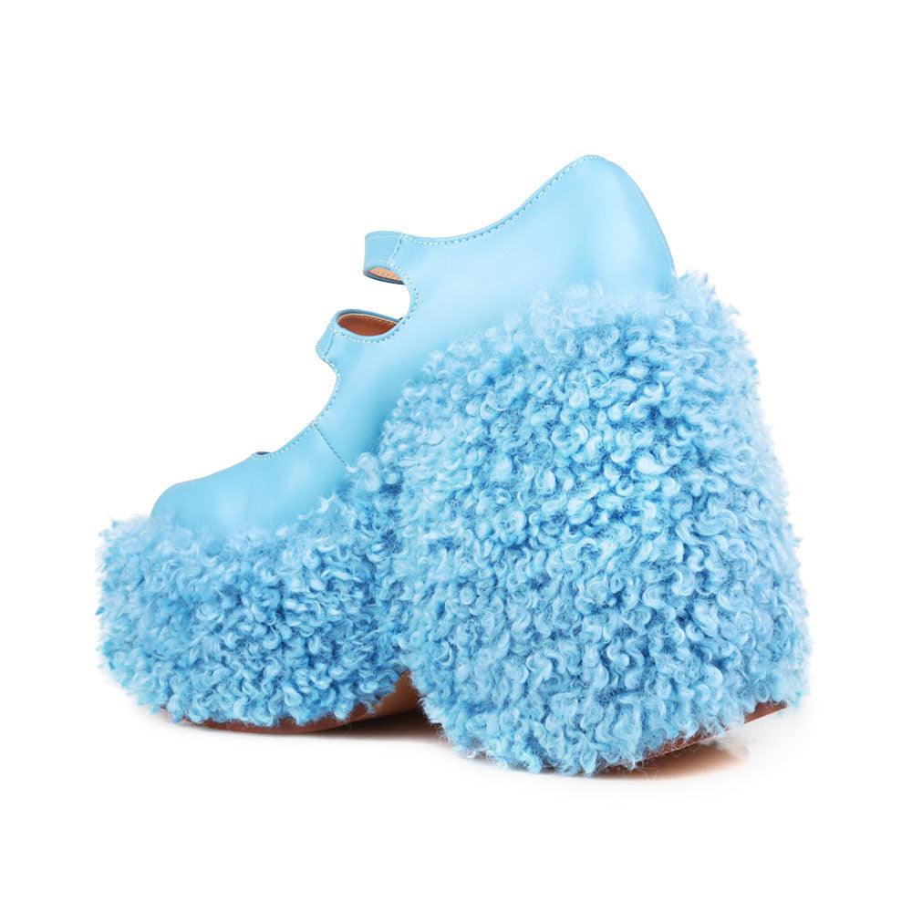 Women's shaggy wedge heel in turquoise-posterior view