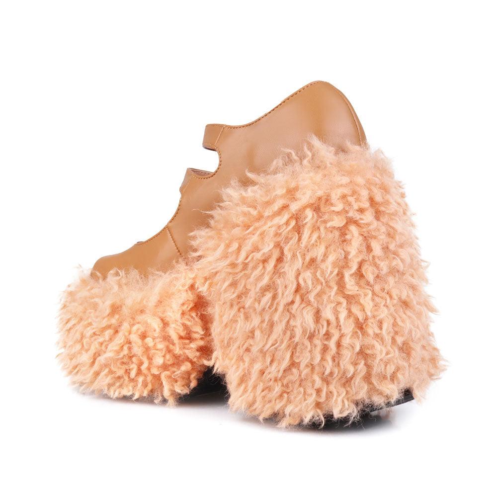 Women's shaggy wedge heel in nude-posterior view