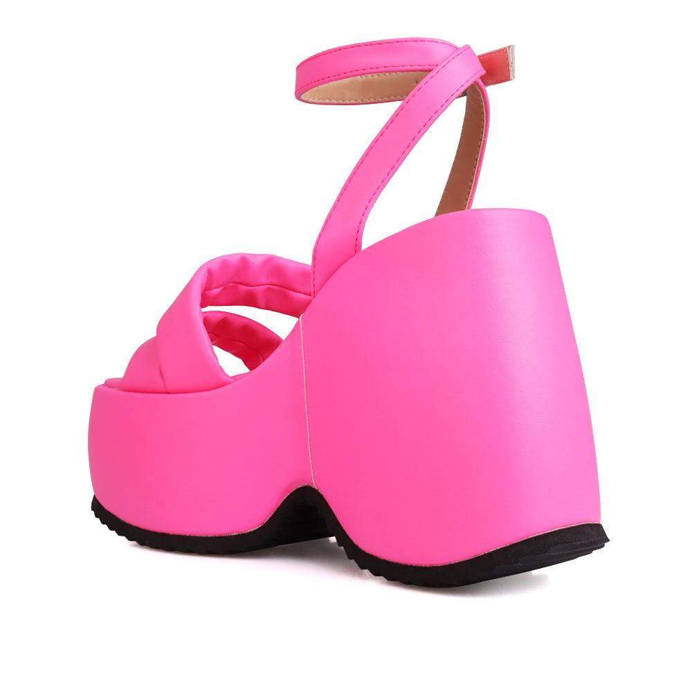 Neon pink suede platform women's heel-posterior view