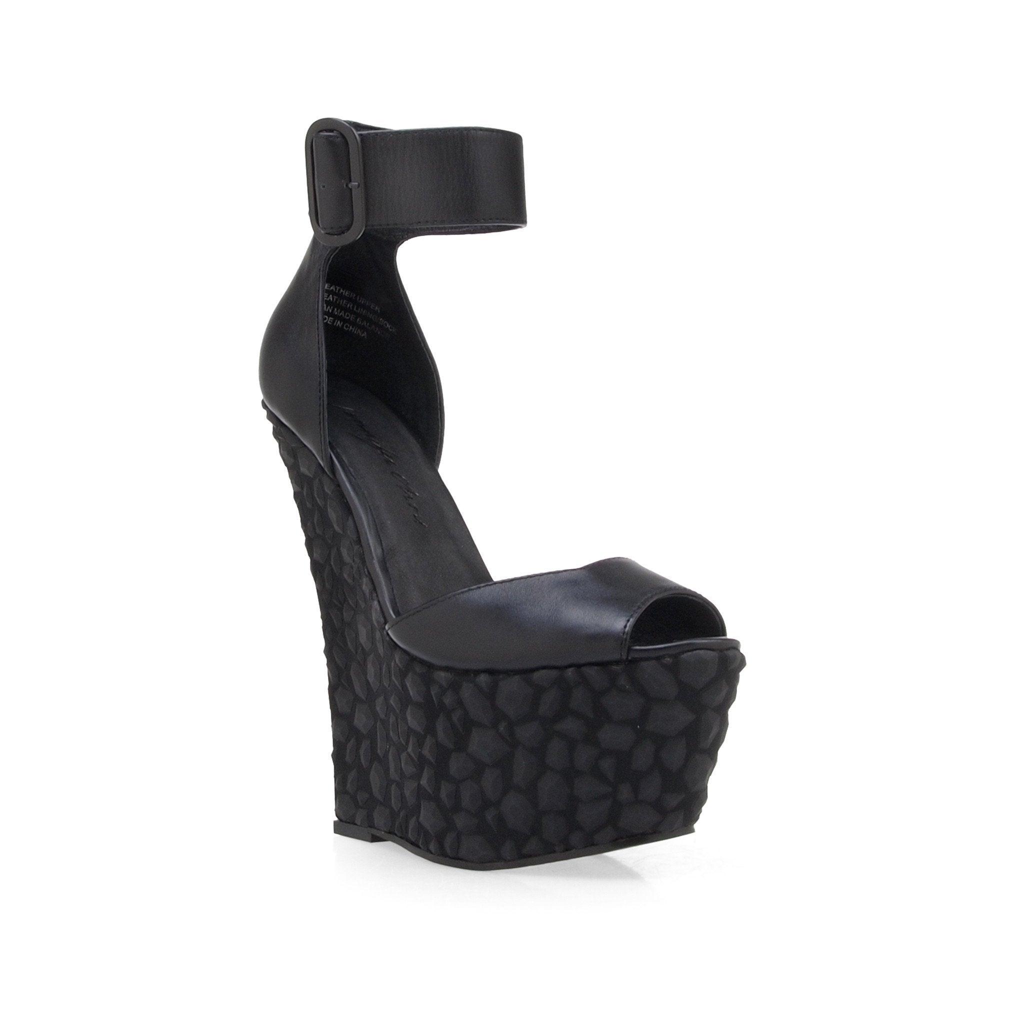 Leather wedge women's heel in black-corner view