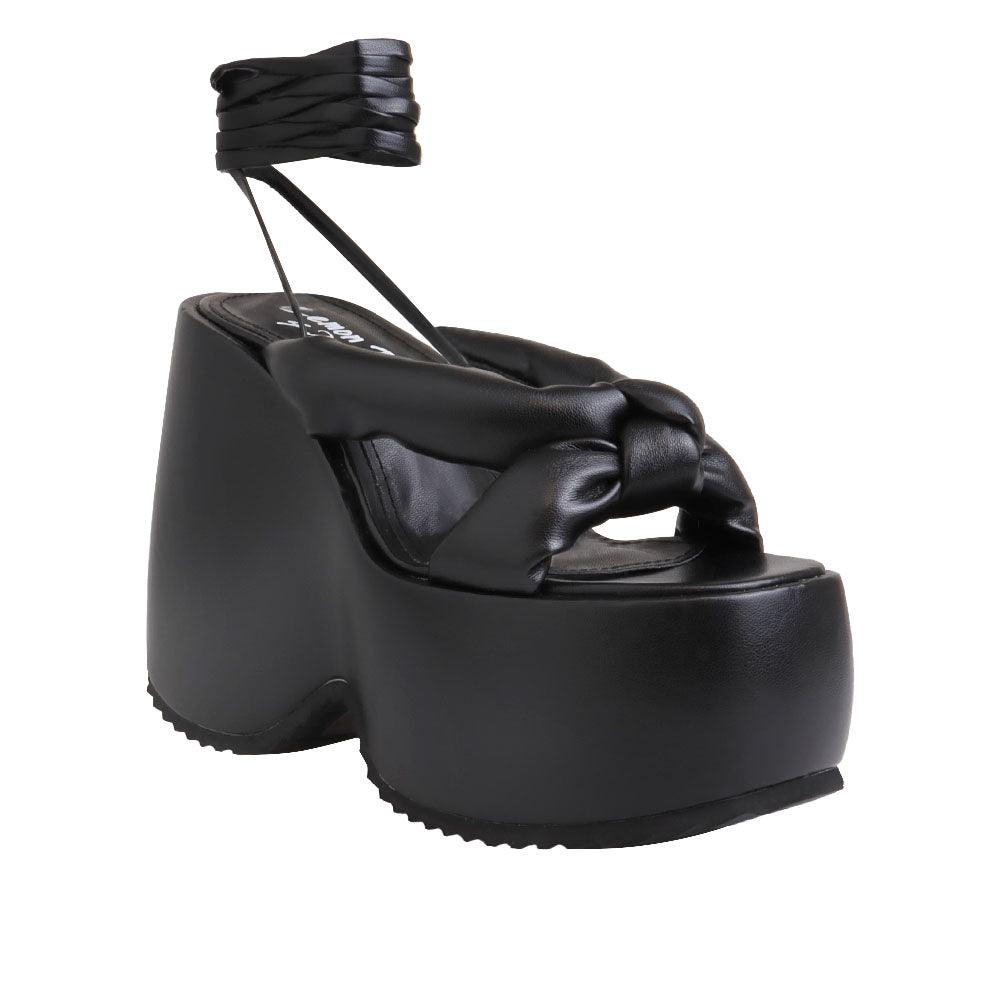 Black vegan leather wedge women's heel-corner view