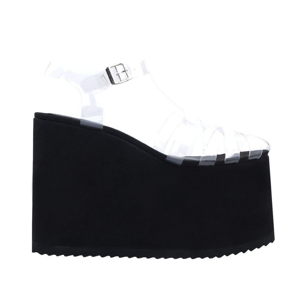 Black coloured vinyl platform bootie with a faux fur-wrapped platform-side view