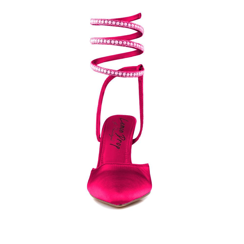 Pumps in a Fuchsia color for women with a beaded ankle buckle design-front view