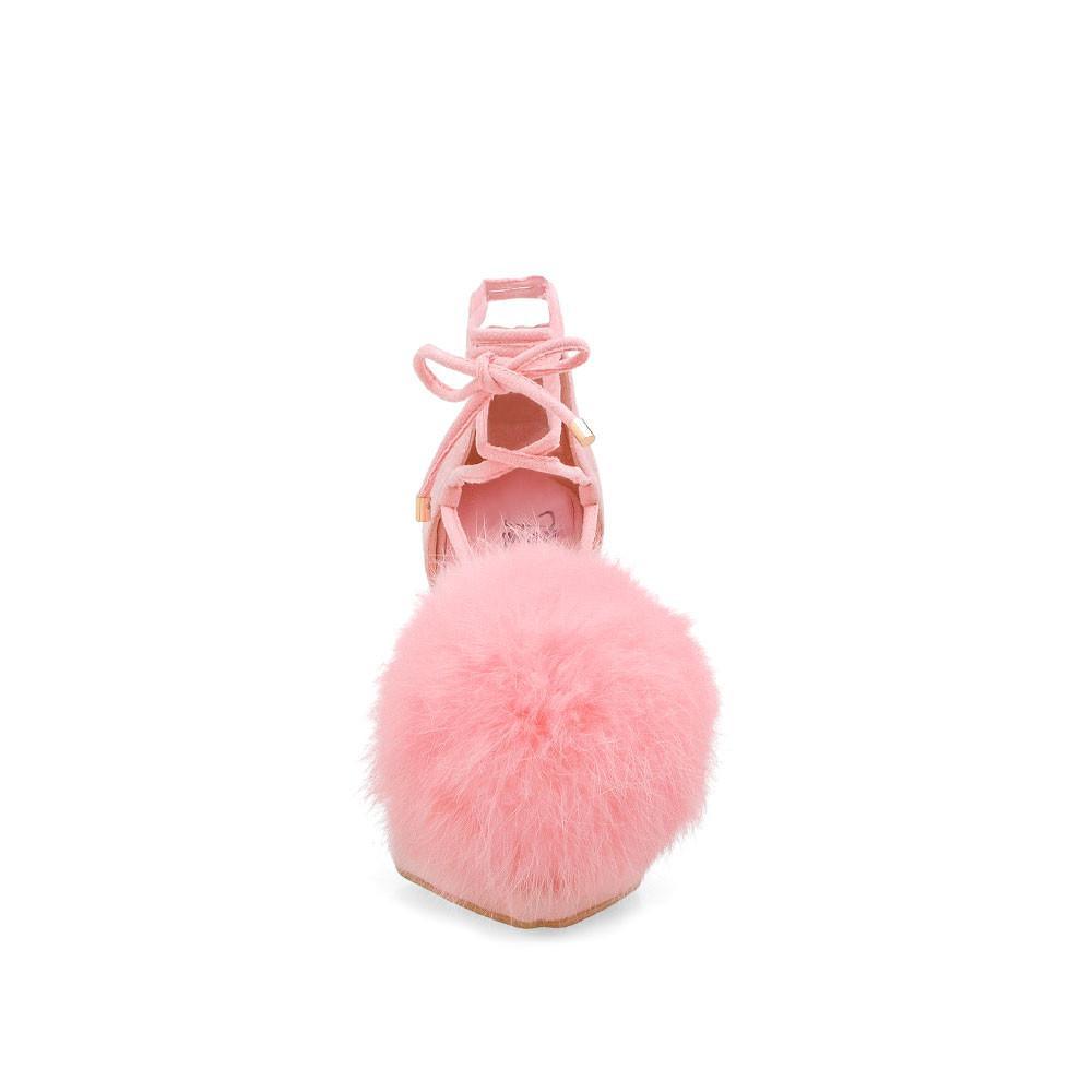 Women's pink-colored high heel pumps with faux fur pom on top and ankle wrap lace up-front view