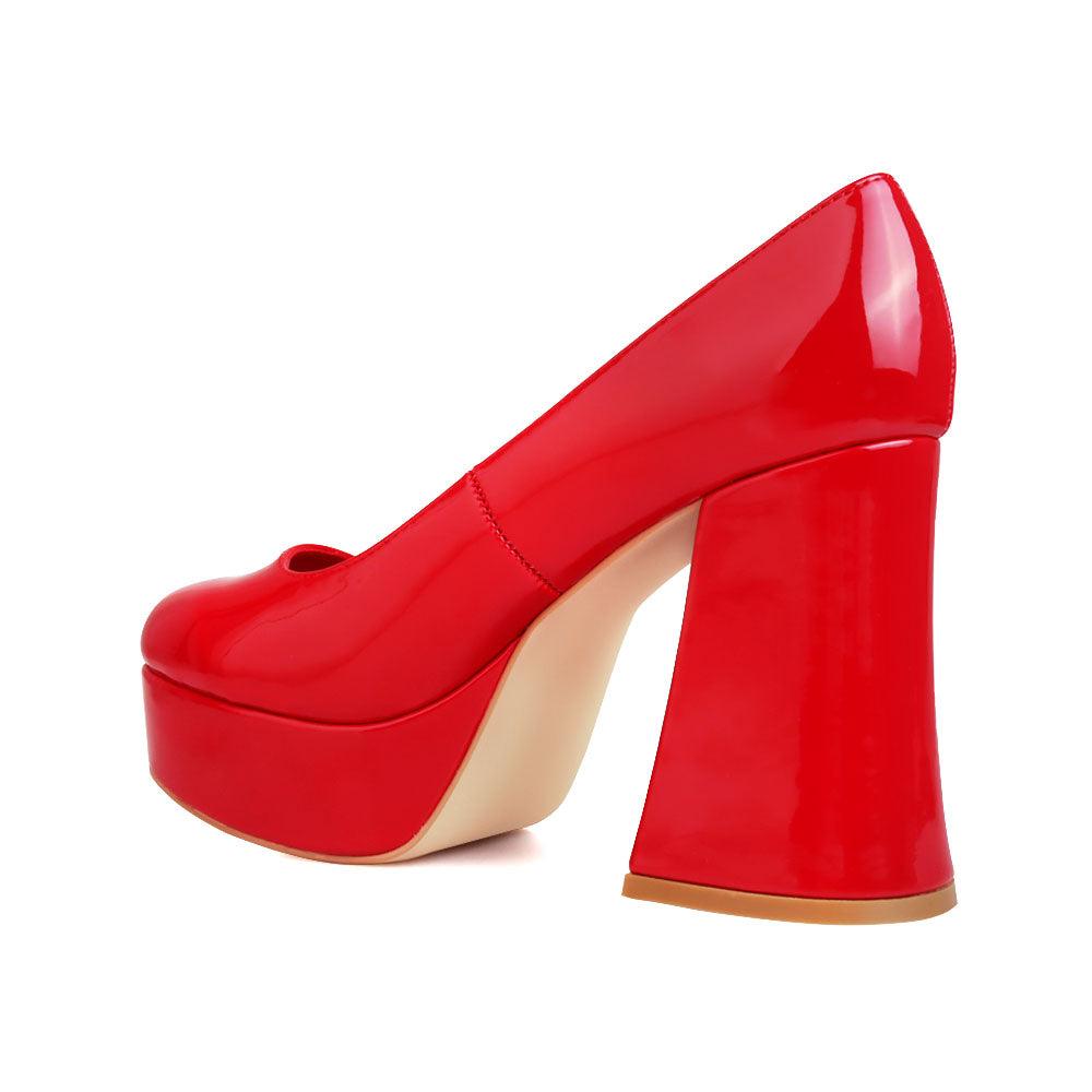 Red women pumps with platform heel-posterior view