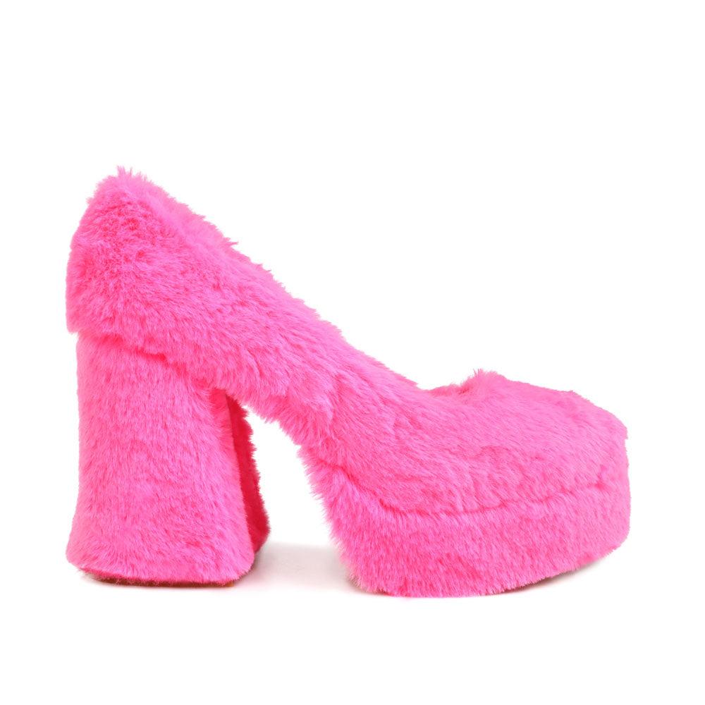 Pink fur women pumps with platform heel-side view