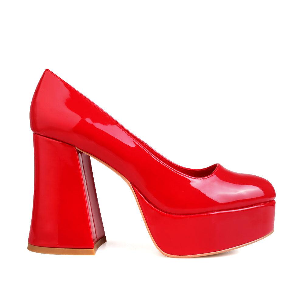 Red women pumps with platform heel-side view