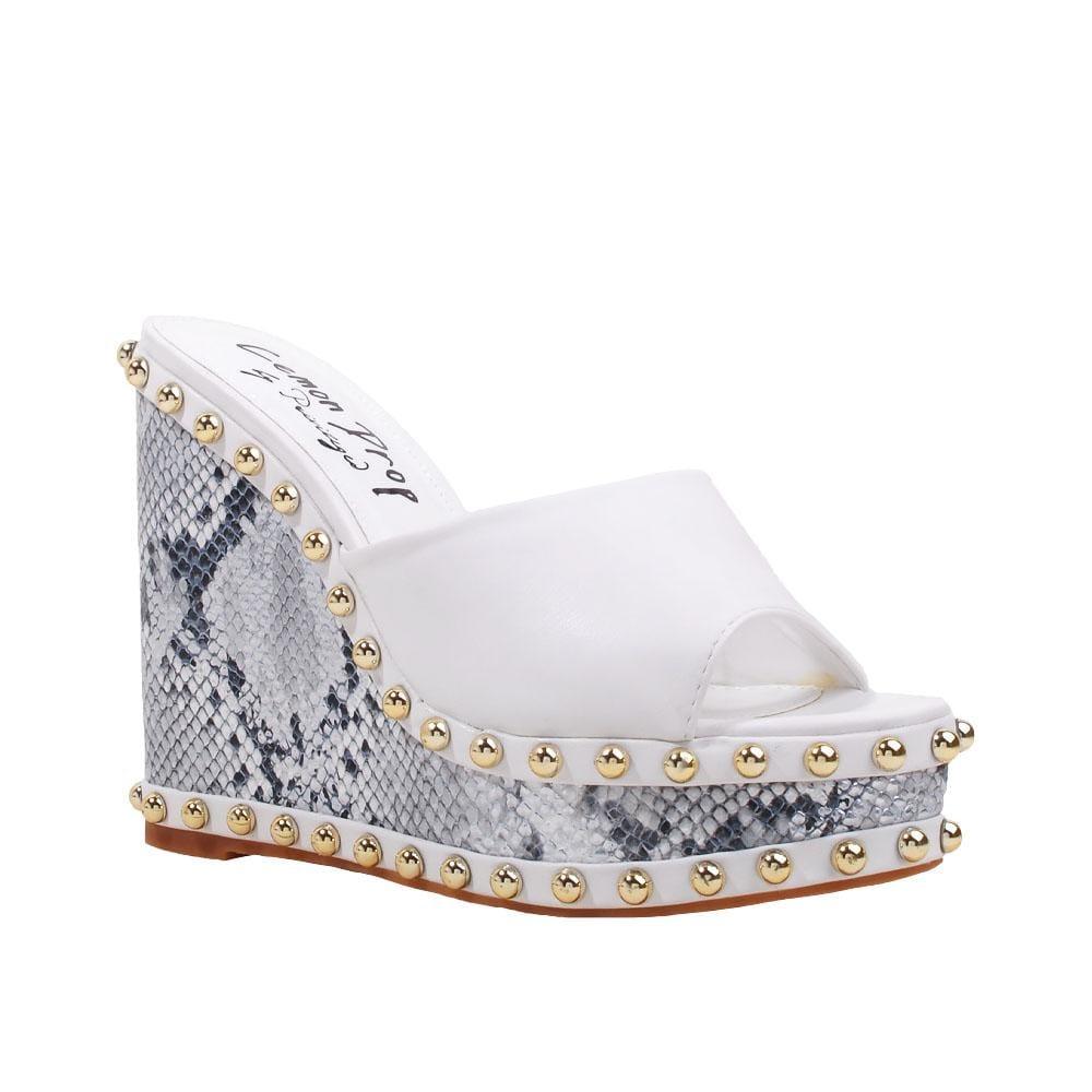 Metallic studded white and black wedge shoes for women with a white top-corner view