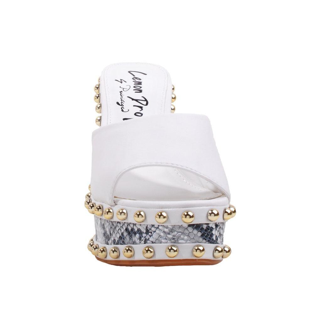 Metallic studded white and black wedge shoes for women with a white top-front view