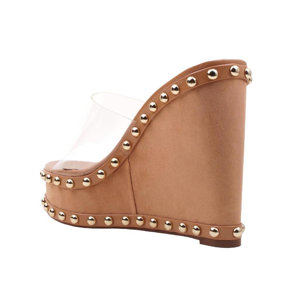 Women's metallic studded tan-colored wedge shoes with a transparent top-posterior view