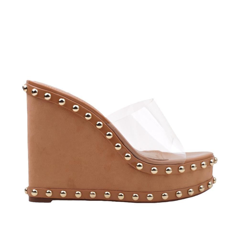 Women's metallic studded tan-colored wedge shoes with a transparent top-side view