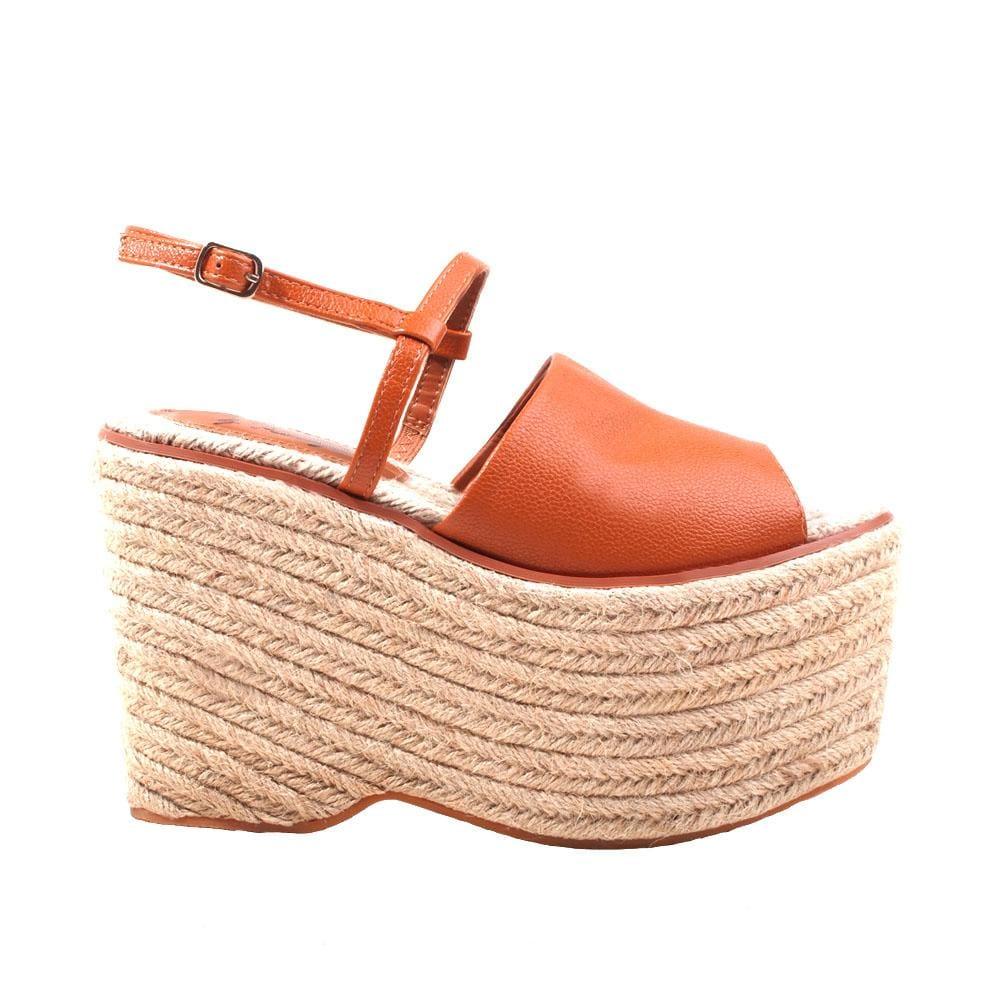 Tan wedge with cognac colored upper and ankle buckle closure