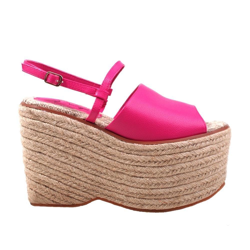 Tan wedge with fuchsia top and an ankle buckle closure