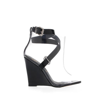 Black colored wedge shoes with symmetrical strap design and clear upper with ankle buckle closure 